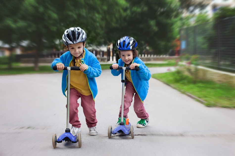 children on scooters