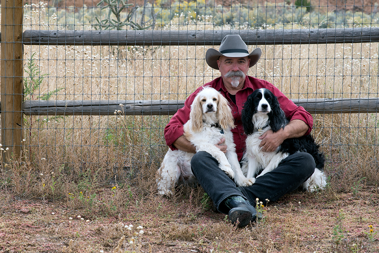 Dr Garber with two of his spaniels