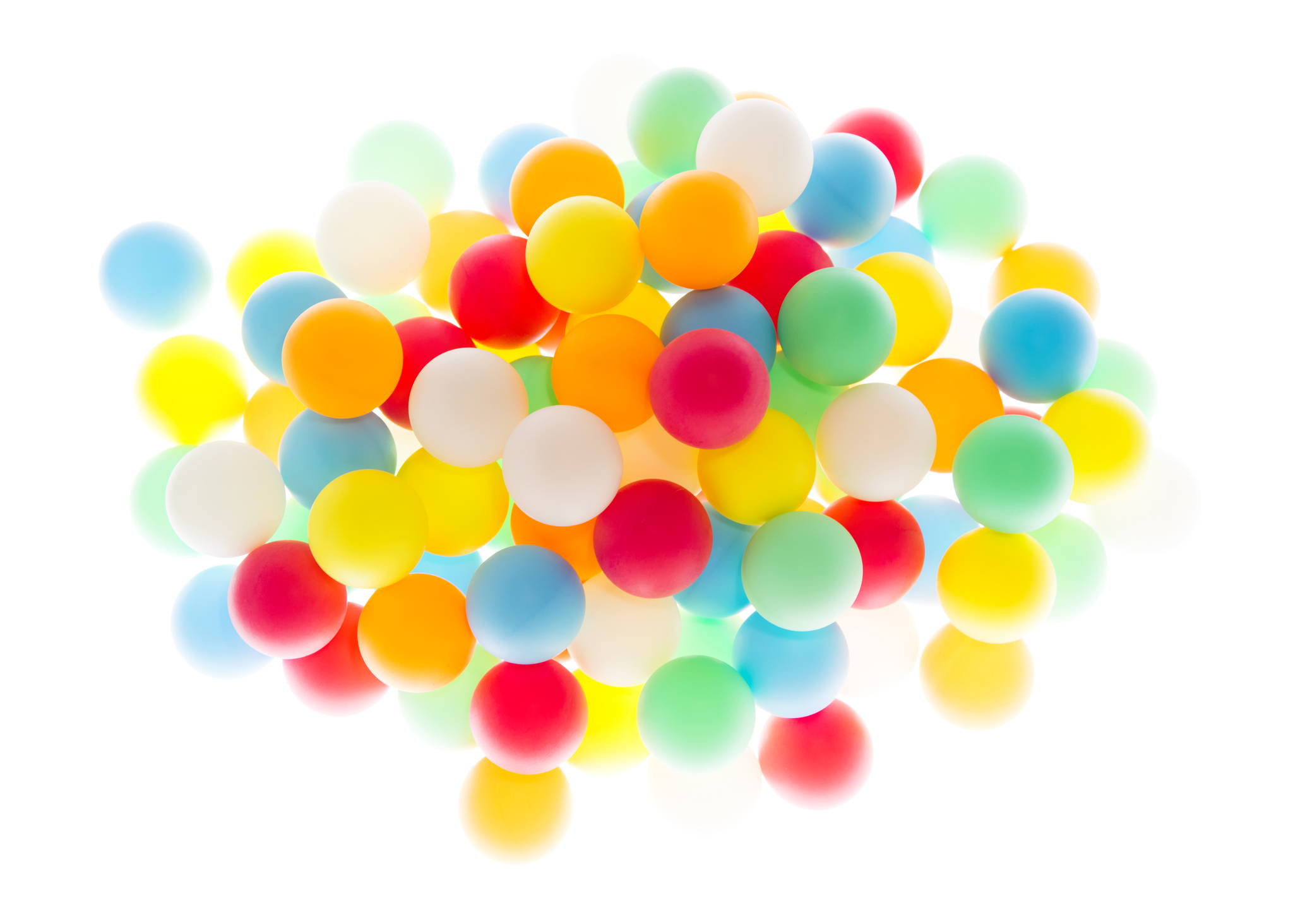 Tight cluster of multi colored spheres on high key white background