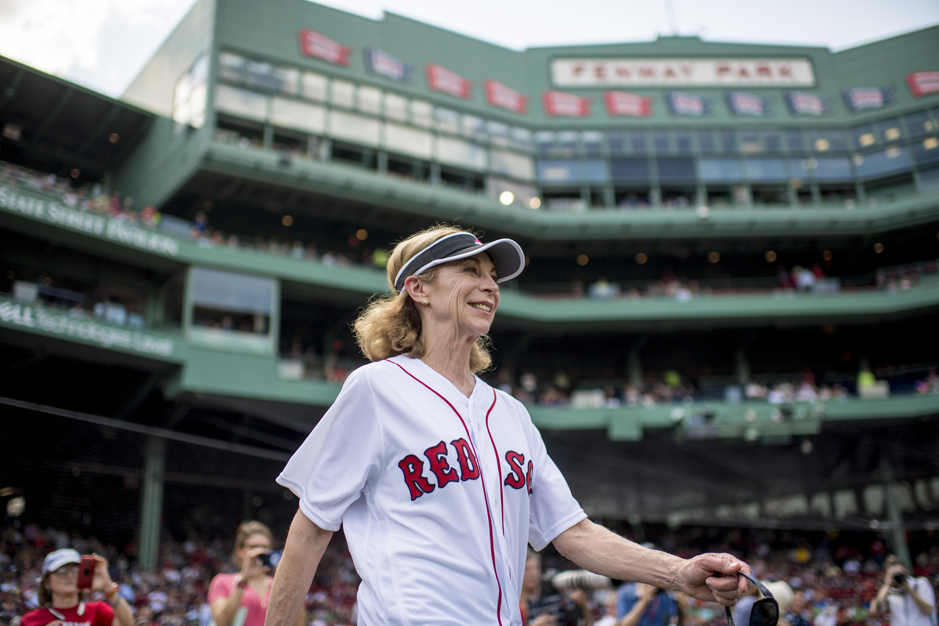 BOSTON, MA - APRIL 16: Katherine Switzer, the first official woman Boston Marathon runner, is introduced before throwing out a ceremonial first pitch before a game between the Boston Red Sox and the Tampa Bay Rays on April 16, 2017 at Fenway Park in Boston, Massachusetts. (Photo by Billie Weiss/Boston Red Sox/Getty Images) *** Local Caption *** Katherine Switzer