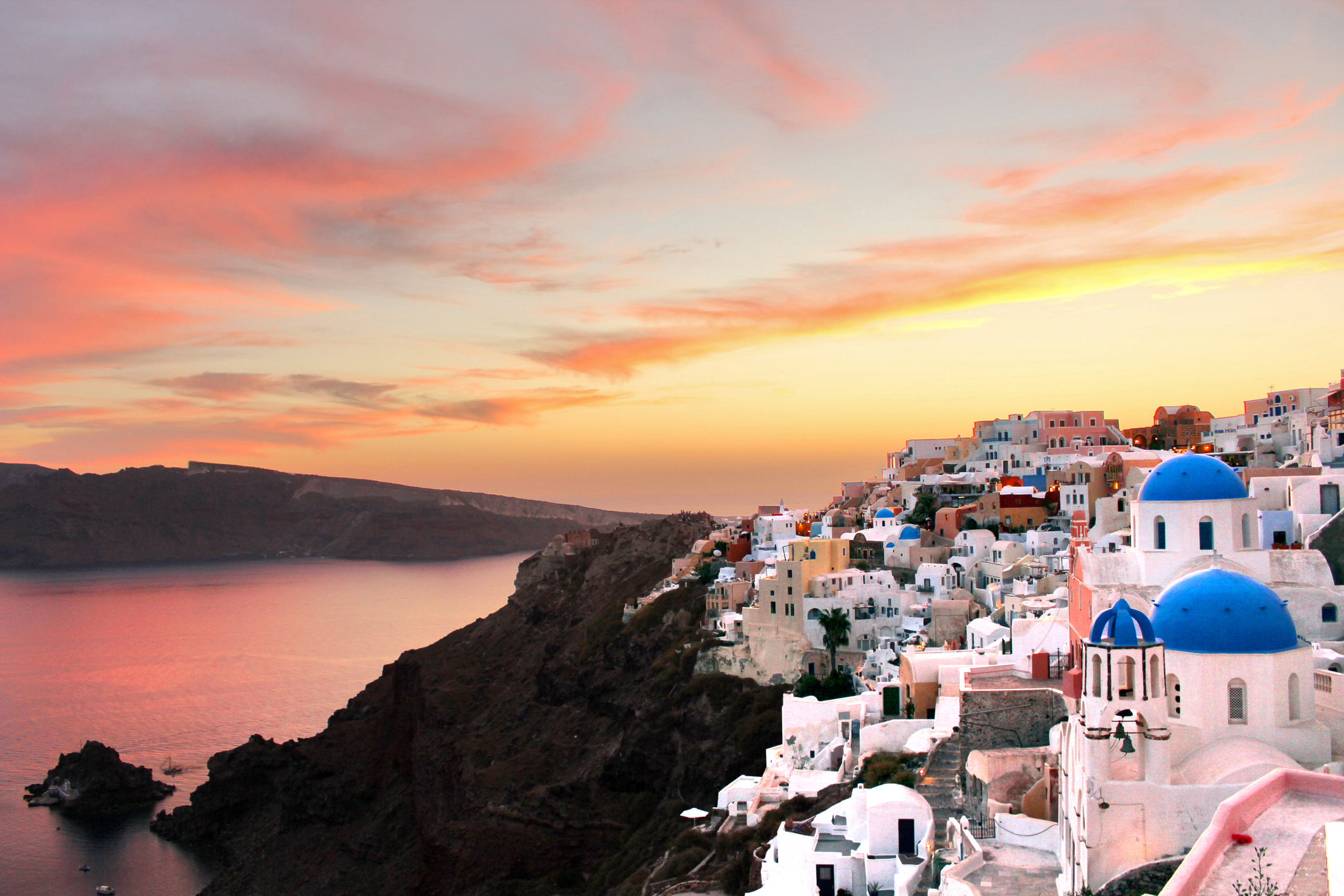 A landscape shot of one of the most famous sightseeing spots in Greece, right after the sunset. You can see the traditional whitewashed houses and the beautiful colors of the sunset at this special location.