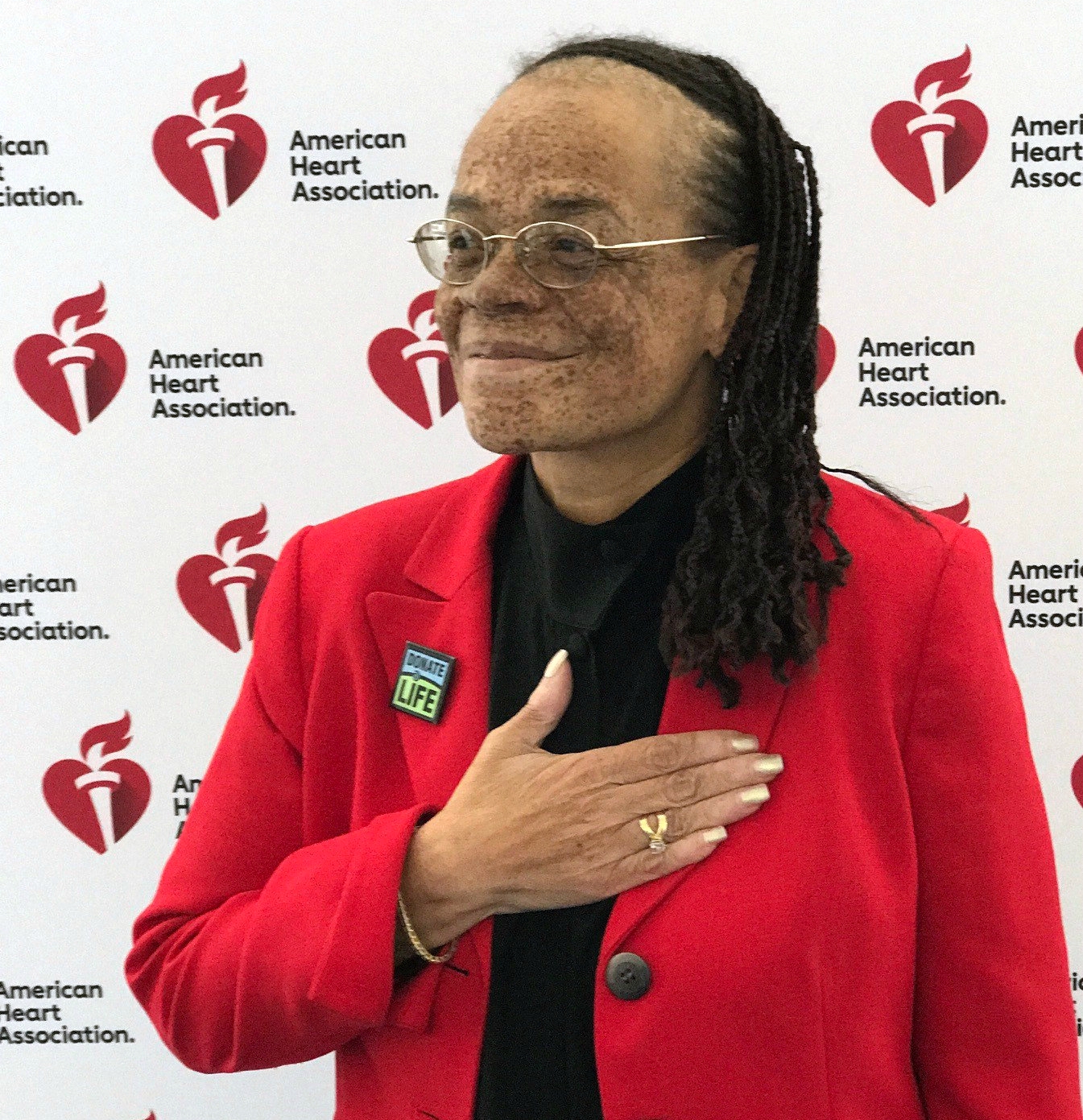 Roxanne Watson places a hand over her new heart.
