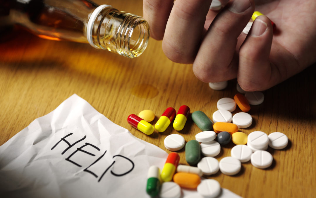 &quot;Colourful medical tablets and alcohol, to portray  suicide.Click on the link below to see more of my medical images.&quot;
