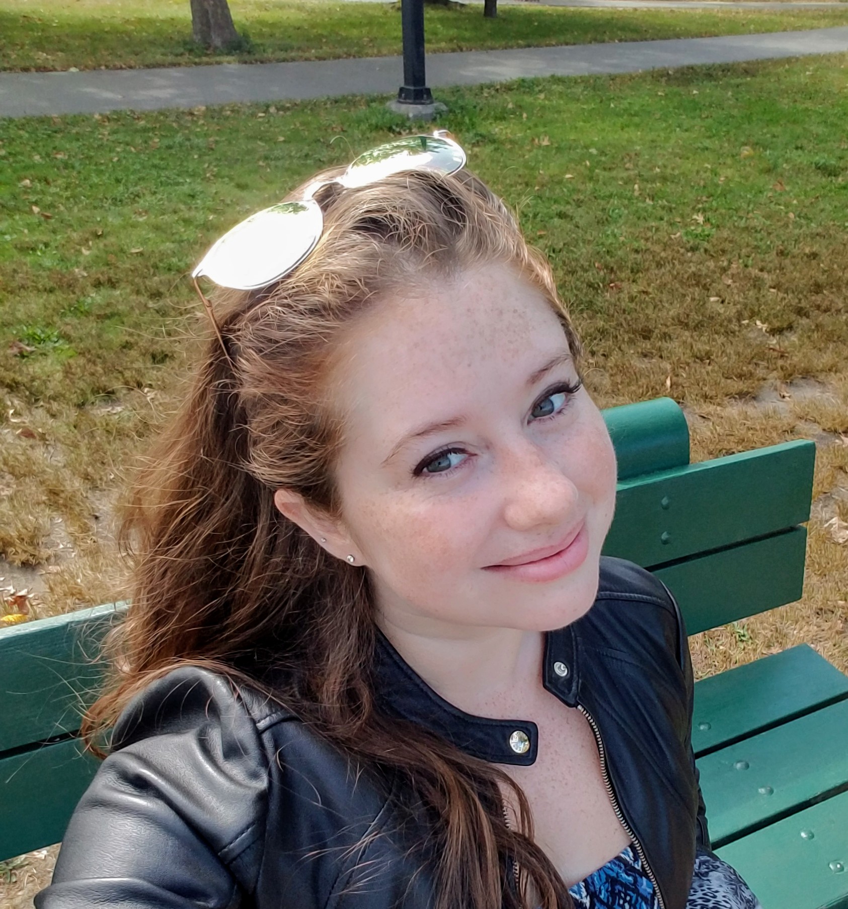 kelly sitting on a bench in Boston