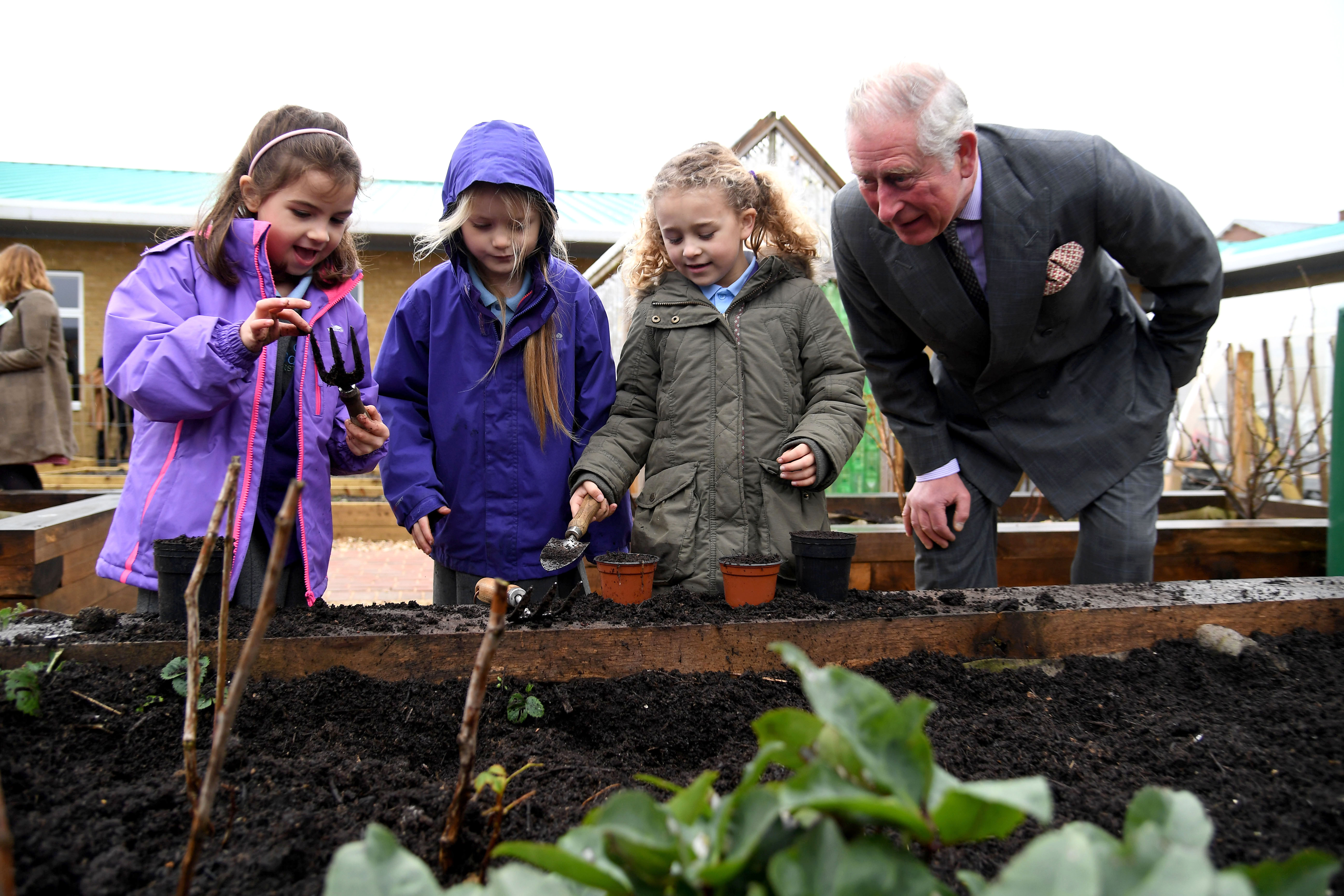 H.R.H. The Prince of Wales with children from Damers First School in Poundbury, England. (c) 2017. The Duchy of Cornwall. Photo: Finnbarr Webster. Used with permission.