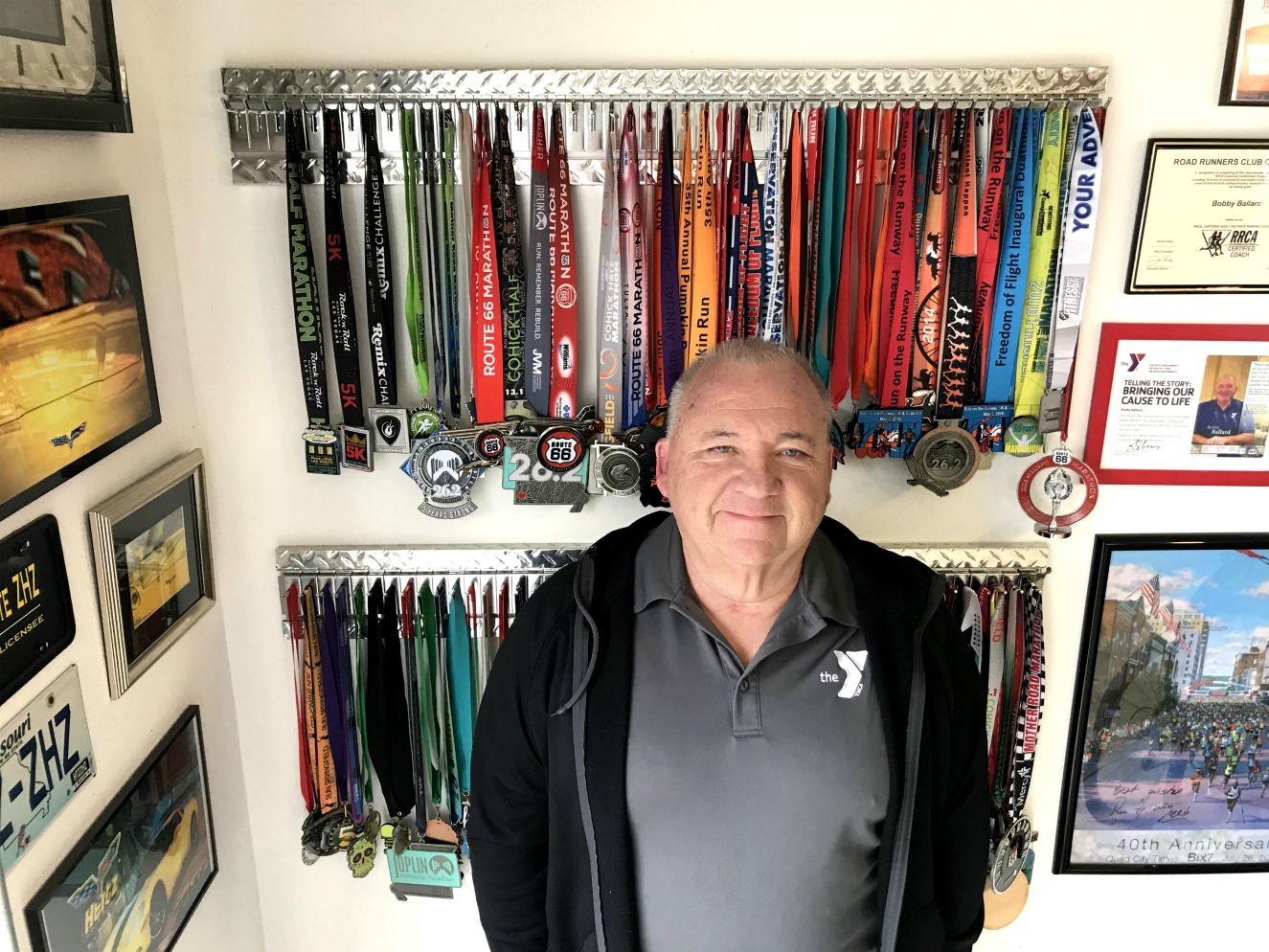 Bobby Ballard at home with his collection of medals earned since beginning his fitness journey in January 2010. Photo by Jane Ballard.