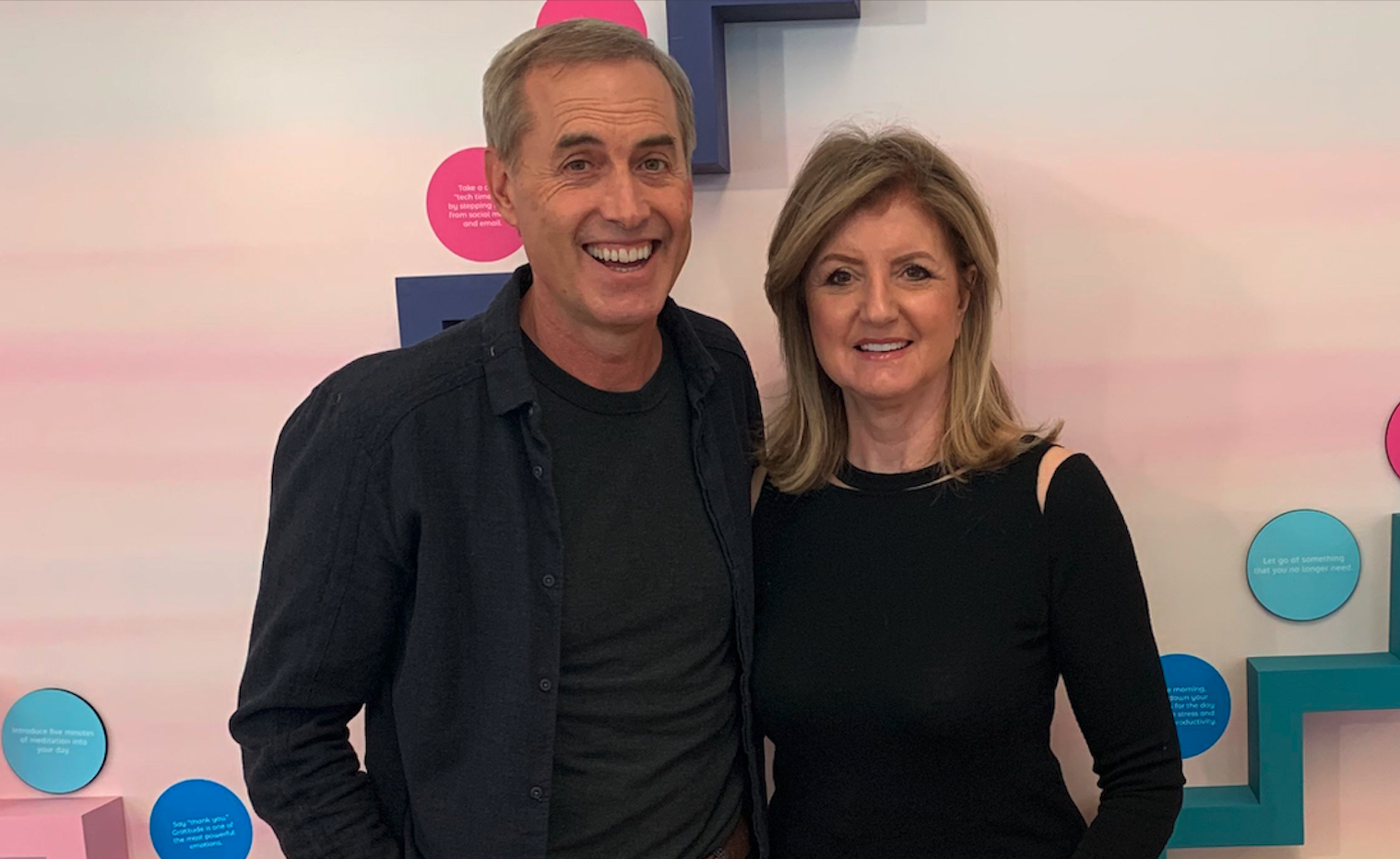 B.J. Fogg and Arianna Huffington in front of Thrive’s Microstep Wall.