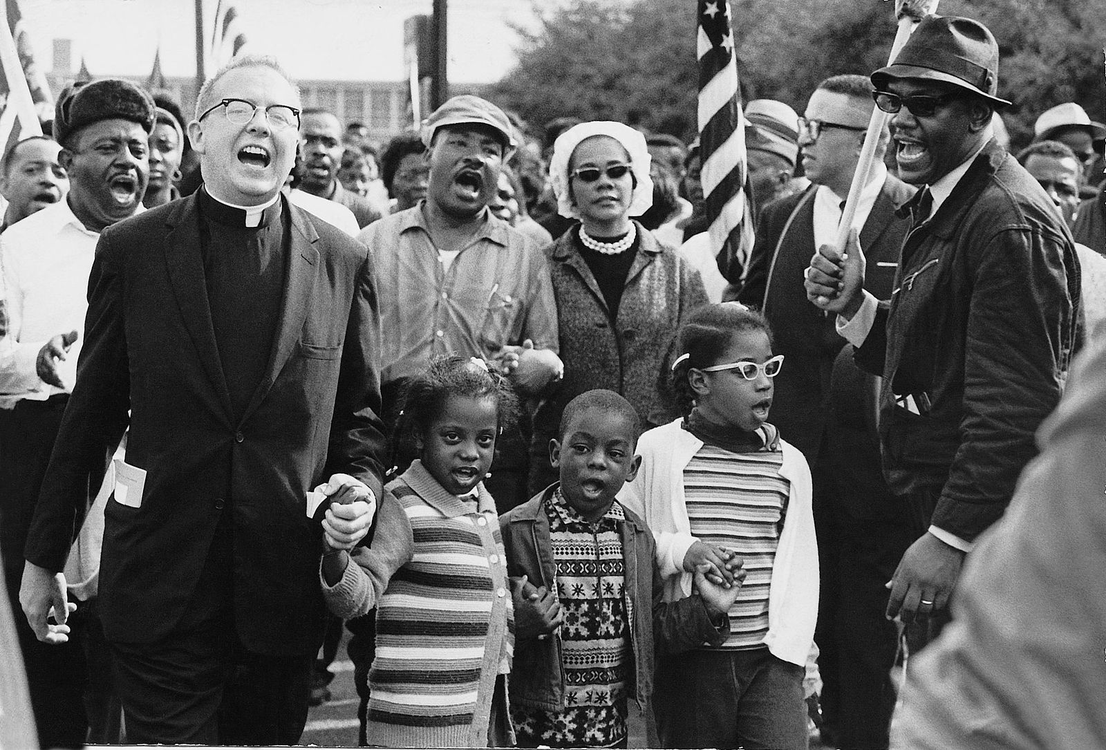 Dr. Ralph David Abernathy and his wife Mrs. Juanita Abernathy and their children with Dr. and Mrs. Martin Luther King march on the front line, leading the SELMA TO MONTGOMERY MARCH in 1965 for voting rights.