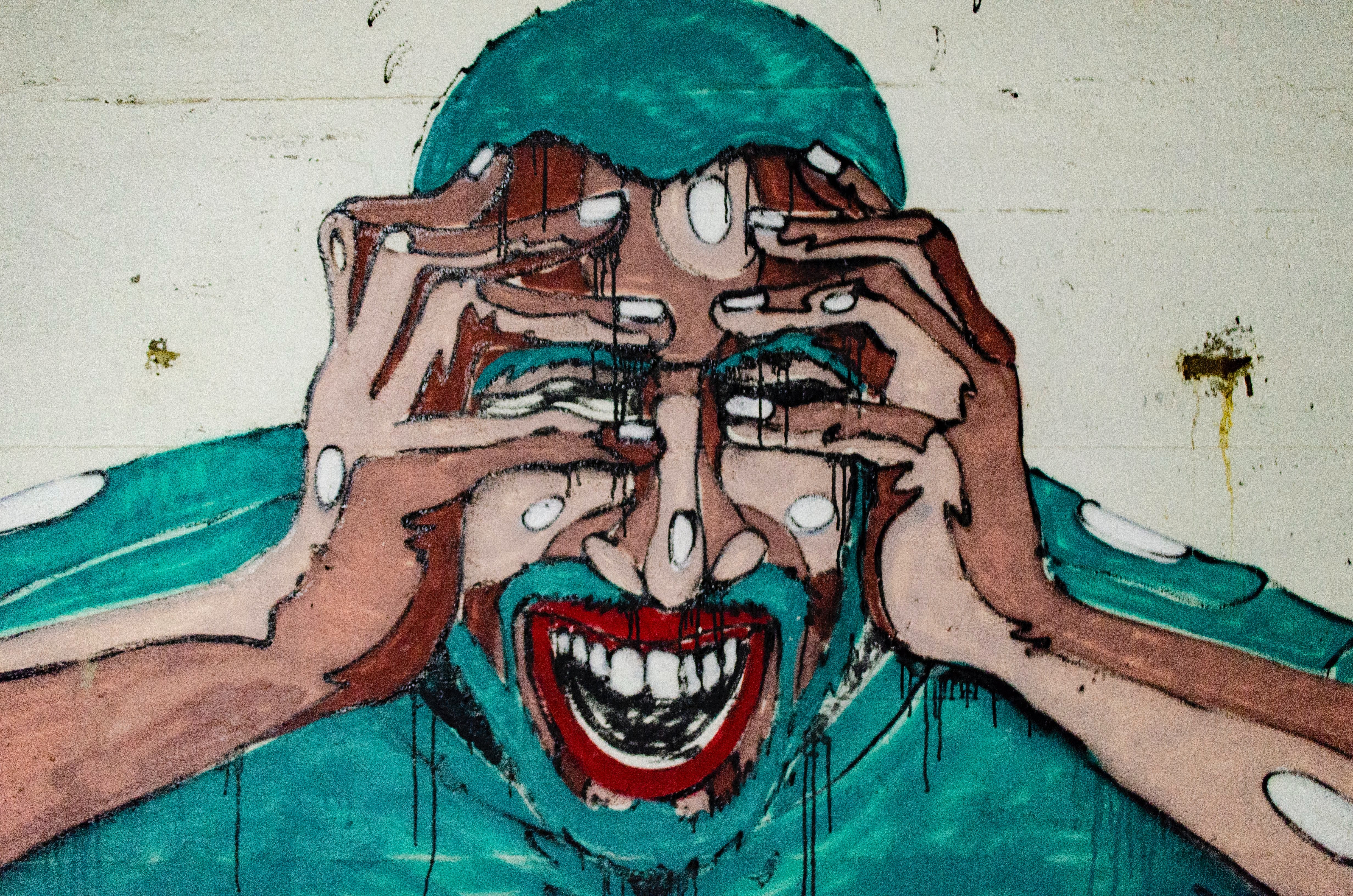 painting of man covering face with both hands
