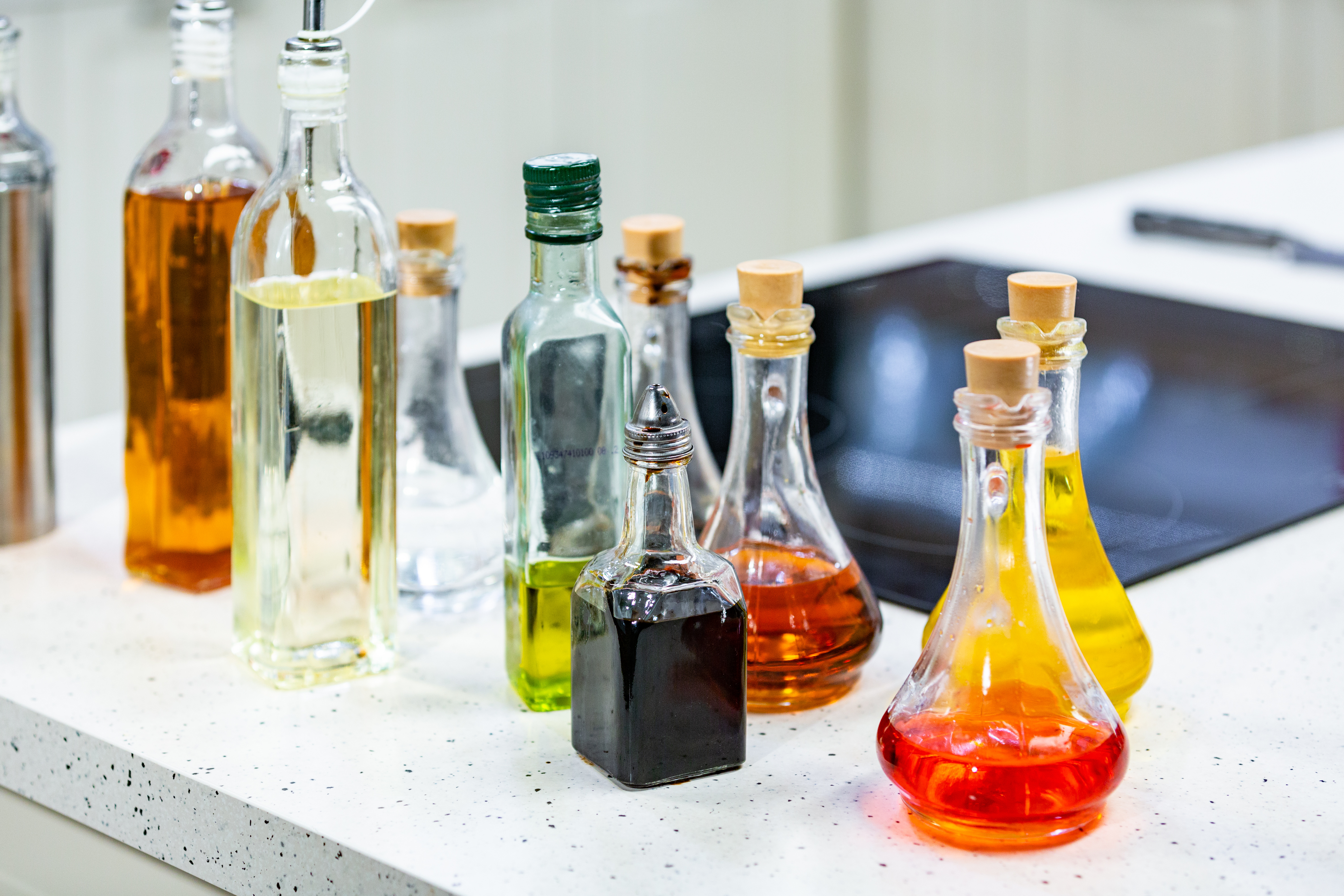 Small bottles of flavored olive oil and balsamic vinegar in the kitchen.