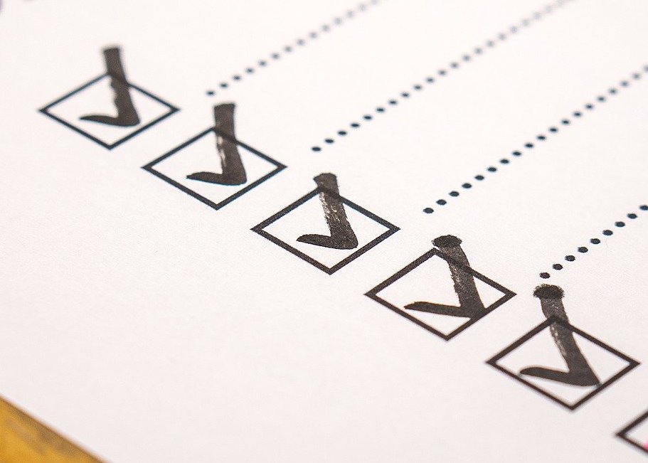 Checkboxes marked with checkmark on white paper