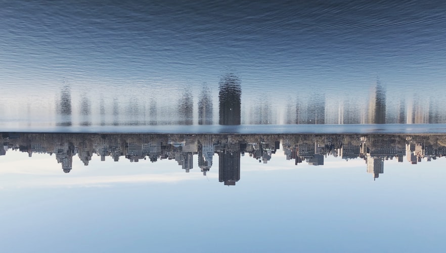 Upside down view of New York City with reflection on water