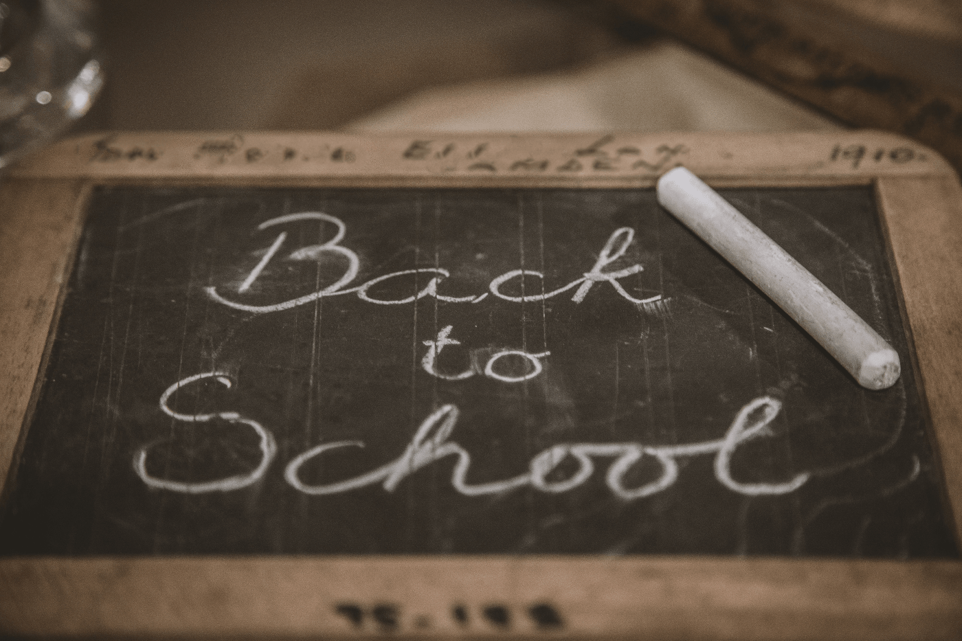 &quot;Back to School&quot; written on a small chalkboard | Learning in Midlife; Once a Luxury, Now a Necessity