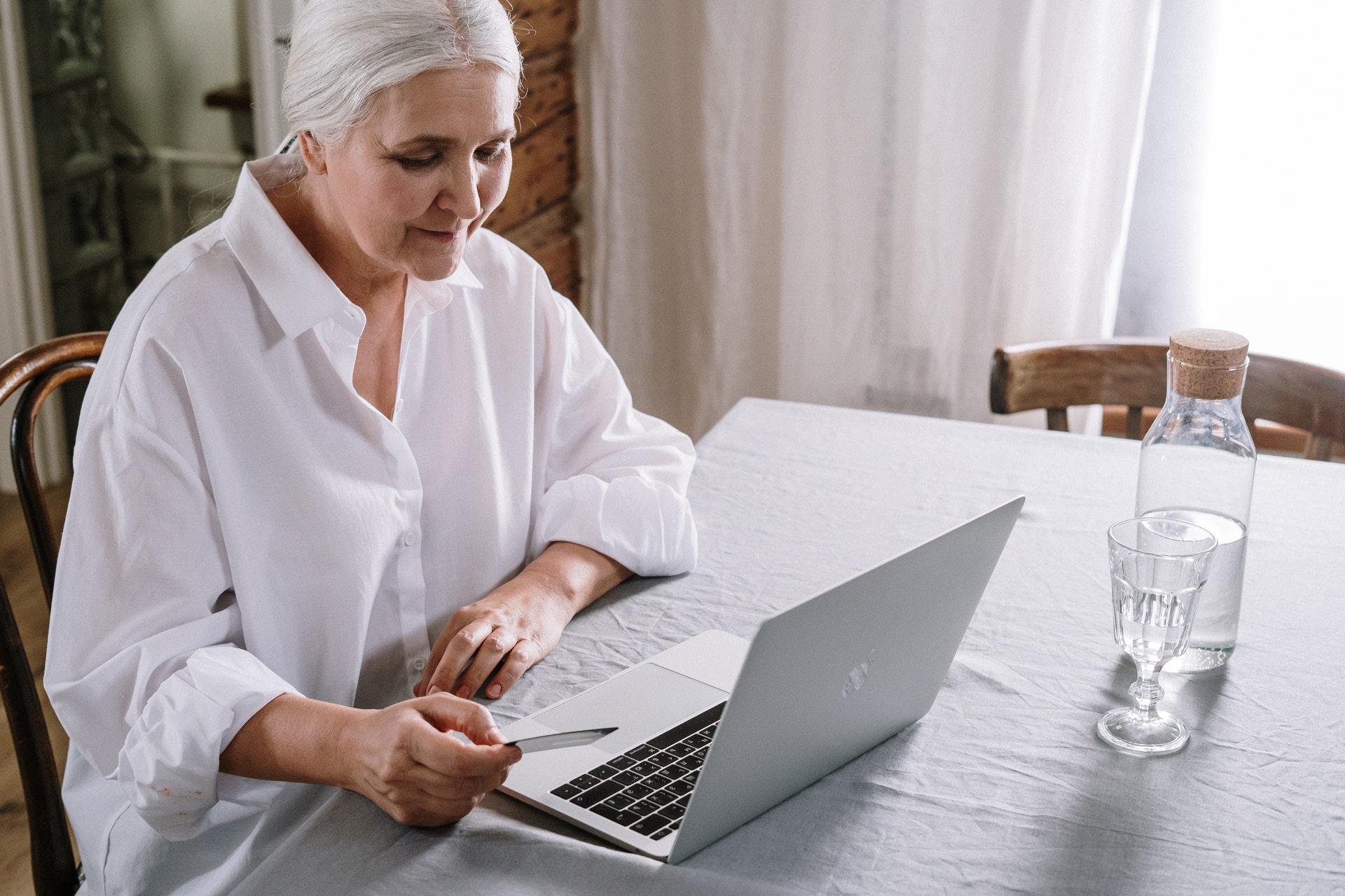 elderly woman using a computer