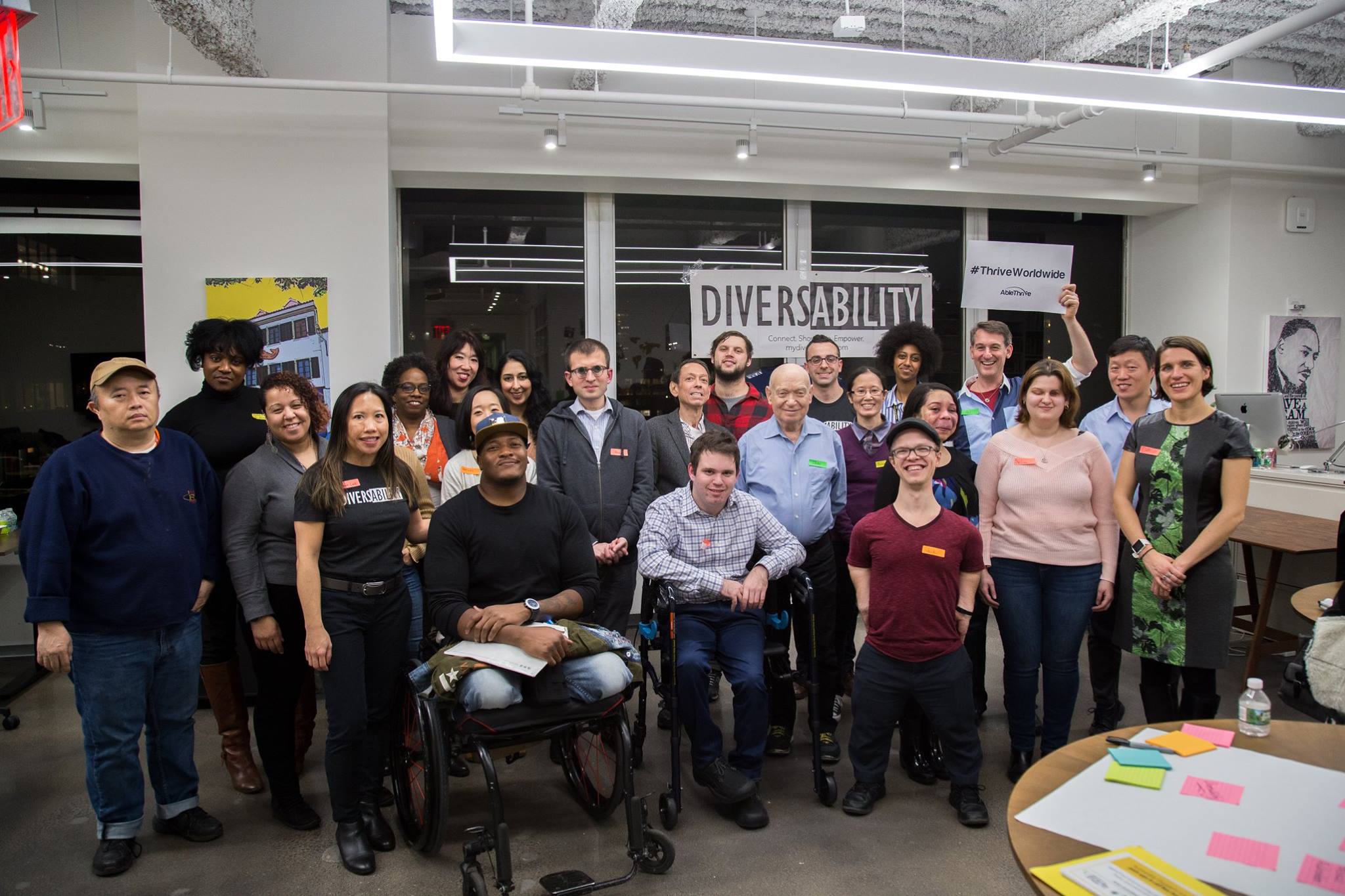 [Photo Description: A large group of Diversability community members posing for a photo at a community event]