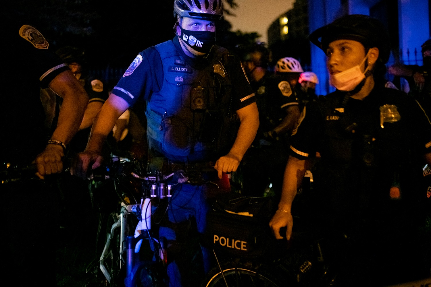 A police officer stares off in a tense moment during a protest against systemic racism and police violence in Washington, D.C., on a rainy August 15 2020, amid the coronavirus pandemic. After an incident earlier in the week that saw Washington Metropolitan Police arrest more than 40 protestors during an alleged riot that witnesses and reports say was a mostly peaceful demonstration, protesters - including many who had been recently released from jail with no charges - again marched across the city for an eleventh week. (Graeme Sloan/Sipa USA)No Use UK. No Use Germany.