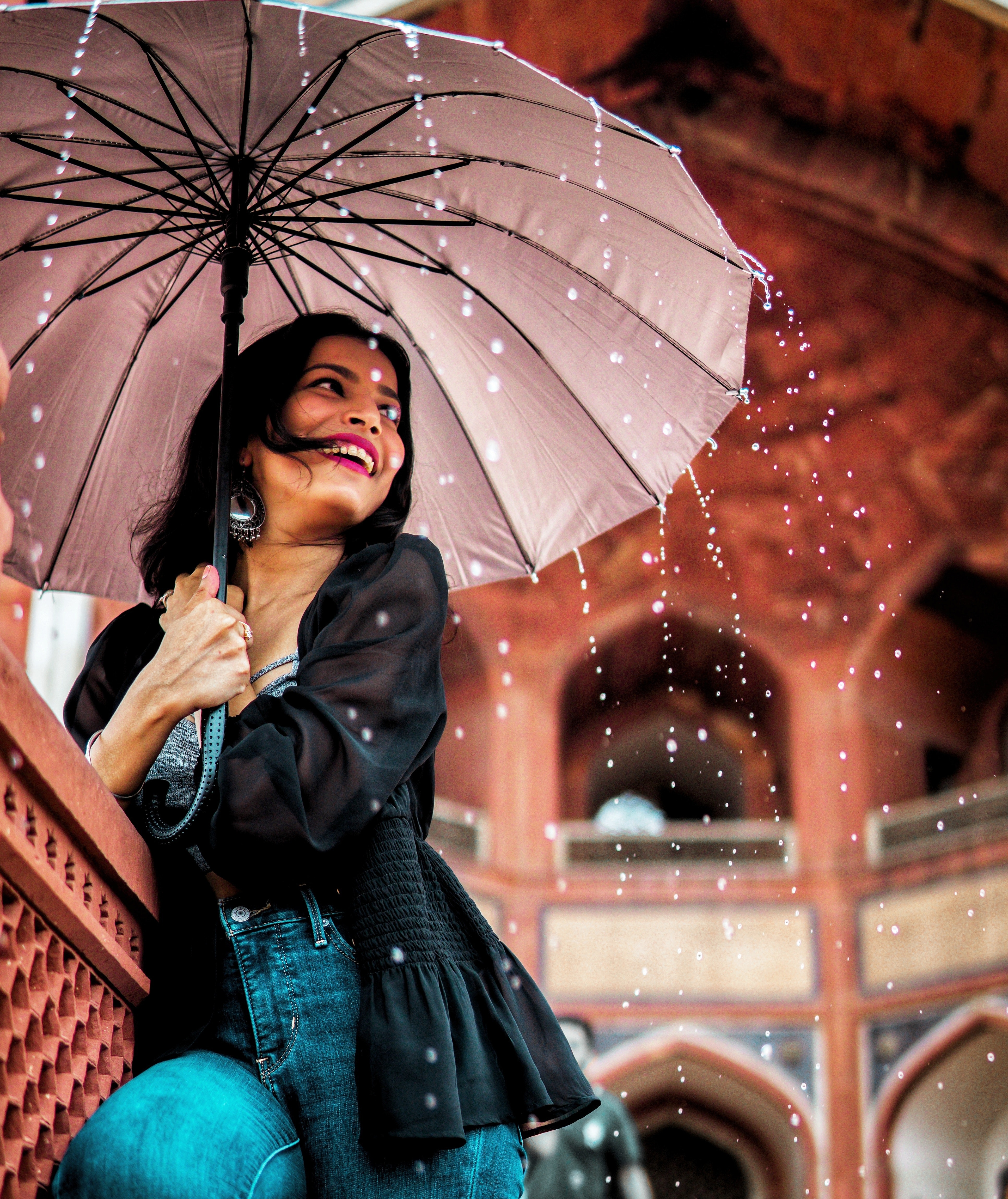 woman smiling with umbrella