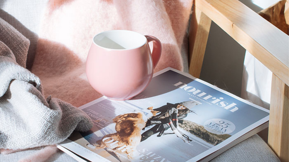 pink cup and magazine
