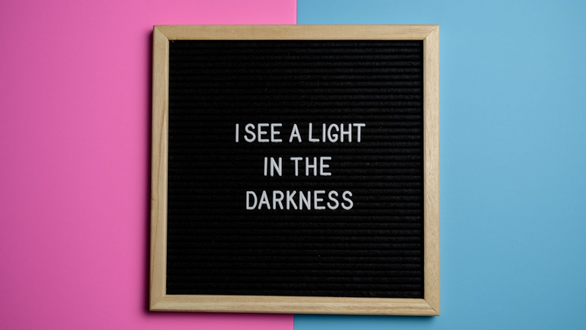 I see the light in the darkness text in letter board