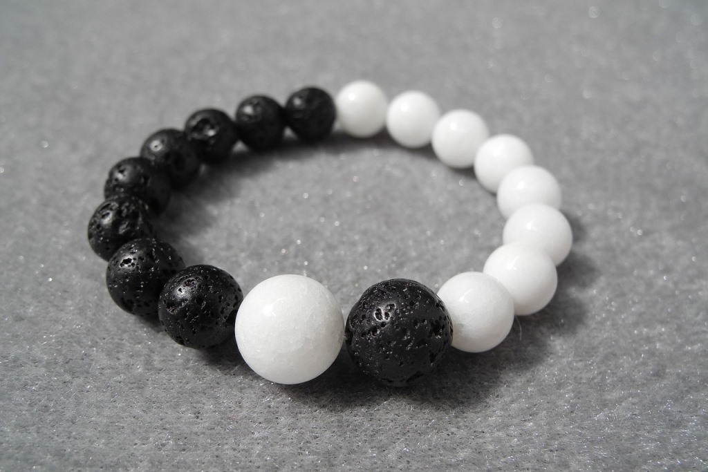 A yin yang bracelet with black and white beads