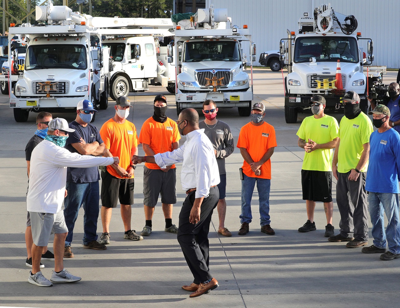 Orlando Utilities Commission vice president LeMoyne Adams, center, thanks lineworkers during a meeting before their departure from OUC&#039;s Pershing Operations Center in Orlando, Fla. for Lafayette, La., Thursday, Aug. 27, 2020. A dozen OUC workers volunteered to assist with power restoration efforts in the wake of the devastation from Hurricane Laura that struck the Louisiana coastline Thursday morning. The lineworkers will join up with other municipal utilities from across the U.S. as a part of a coordinated mutual aid response to the category 4 hurricane. (Photo by Joe Burbank/Orlando Sentinel/TNS/Sipa USA) No Use UK. No Use Germany.