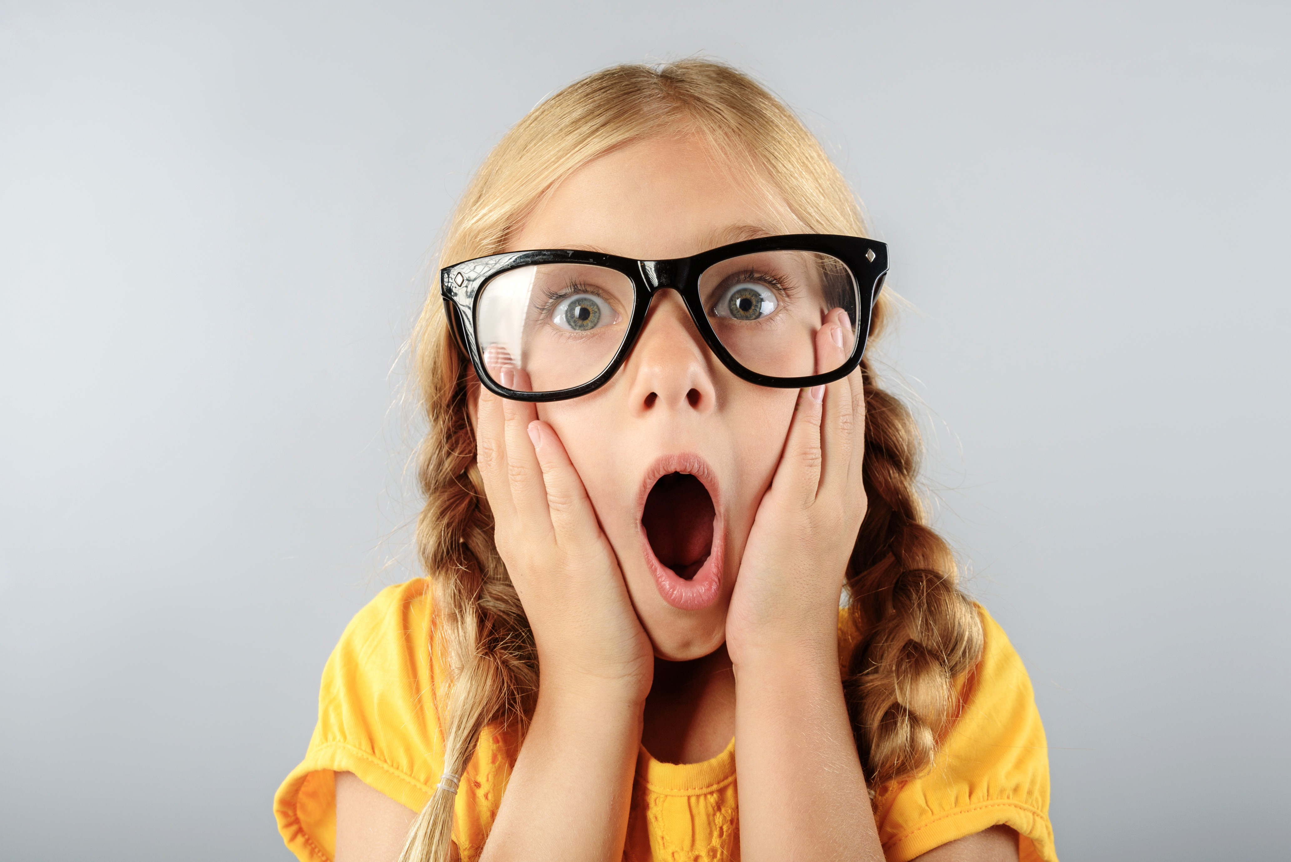 exited child in glasses with copy space