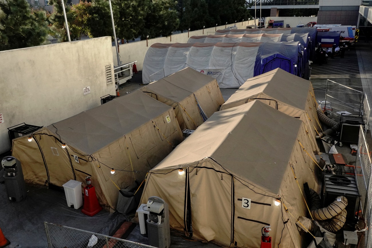 Triage tents for treating COVID-19 patients are seen outside LAC + USC Medical Center during a surge of coronavirus disease (COVId-19) cases in Los Angeles, California, U.S., December 27, 2020.  REUTERS/Bing Guan