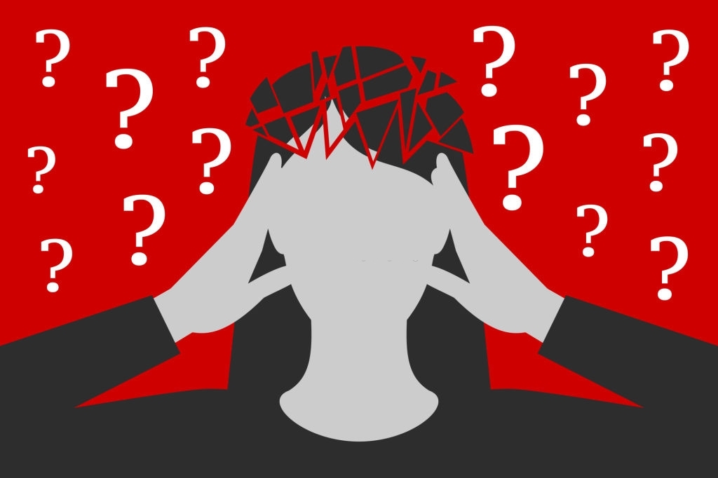 Black-and-white woman is clasping her head with hands, suffering from unbearable headache caused by many questions asked or unresolved, head is broken down to fragments, over depressive red background