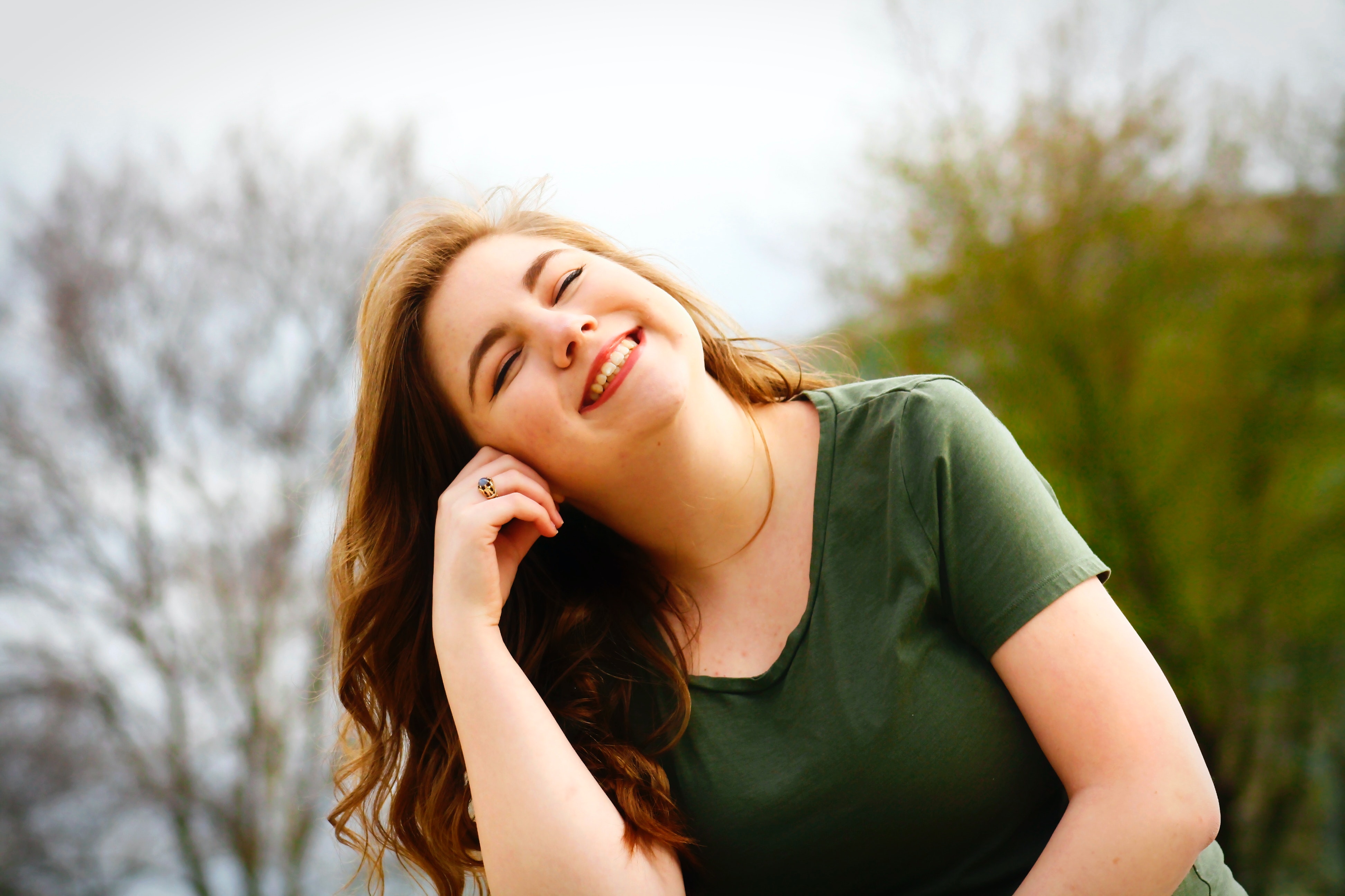 woman smiling with head tilted