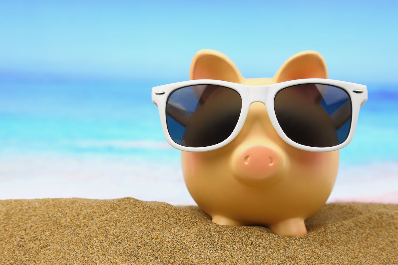 piggy bank wearing sunglasses save money