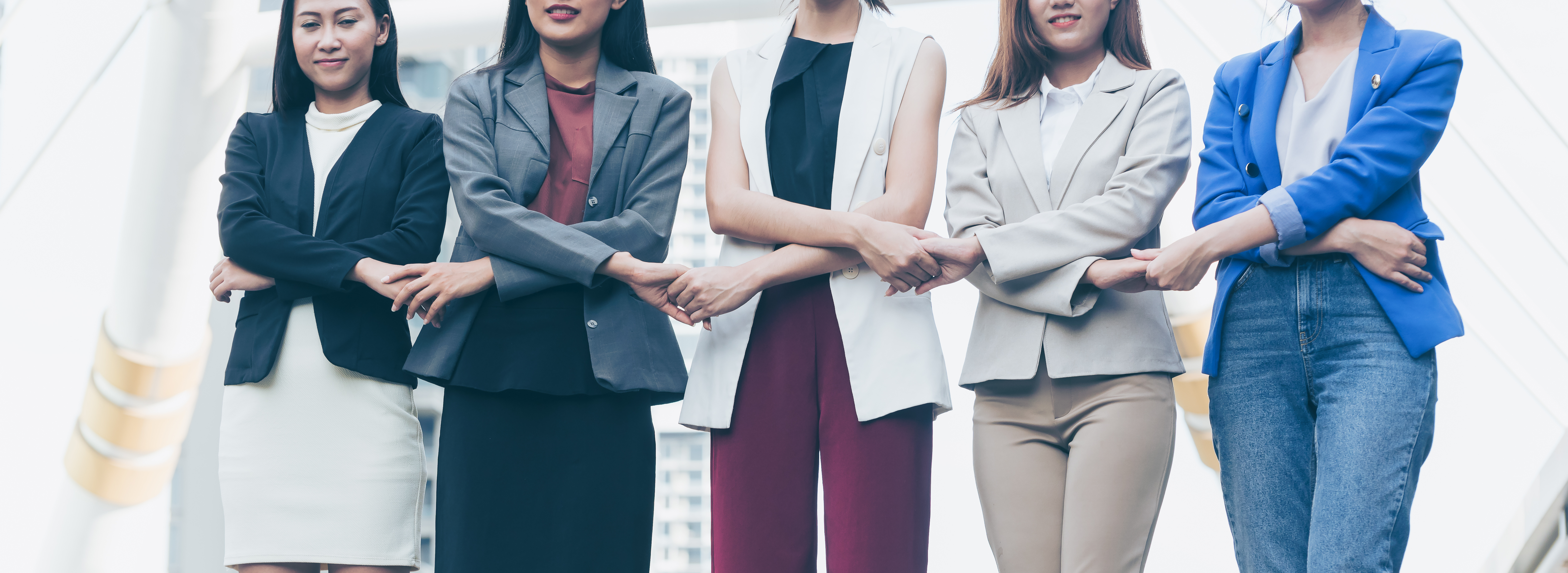Group of business women holding hands support team. Coordinating of business unity in order to succeed in business,cooperation and teamwork business concept .panoramic banner
