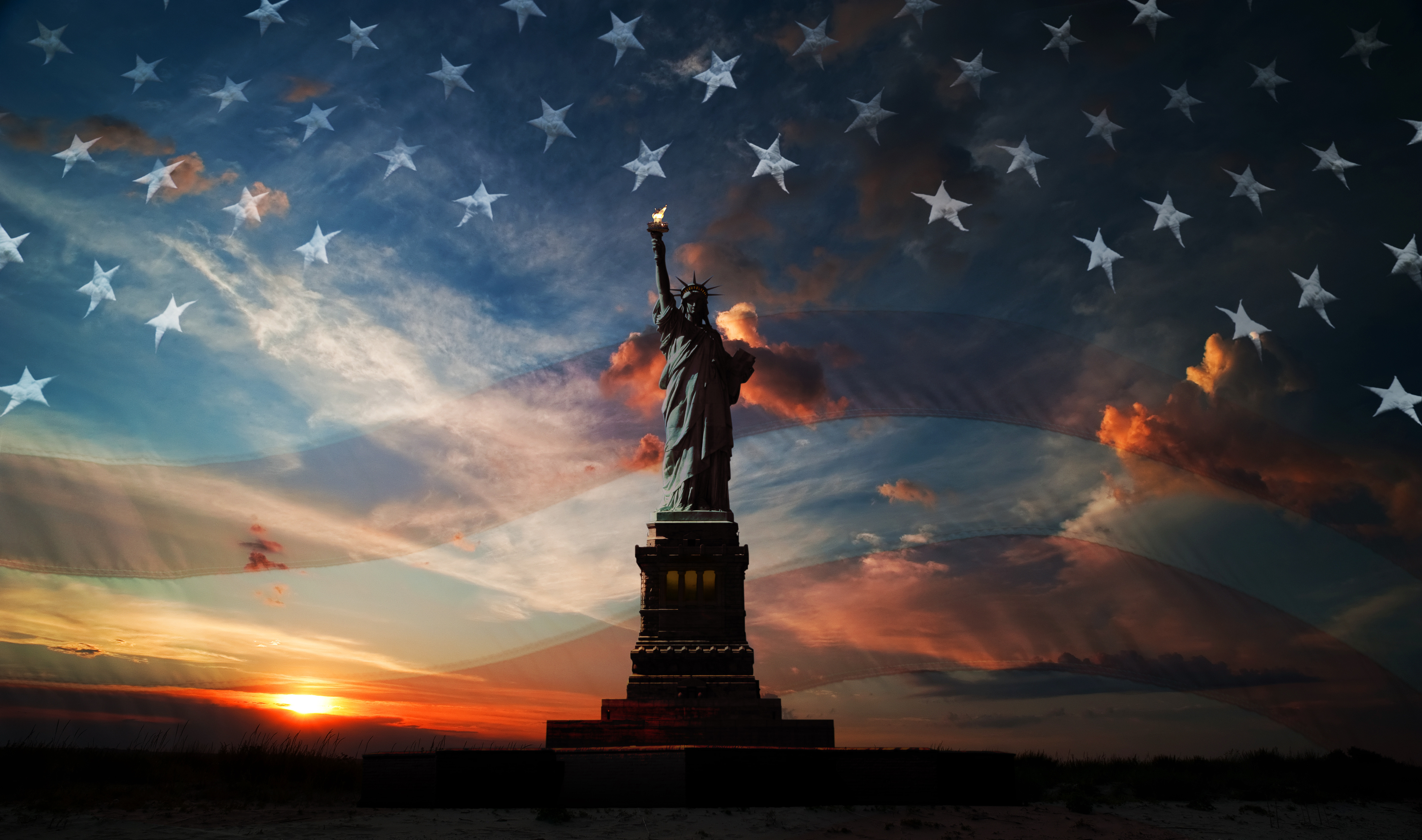 Statue of Liberty on the background of flag usa and sunrise