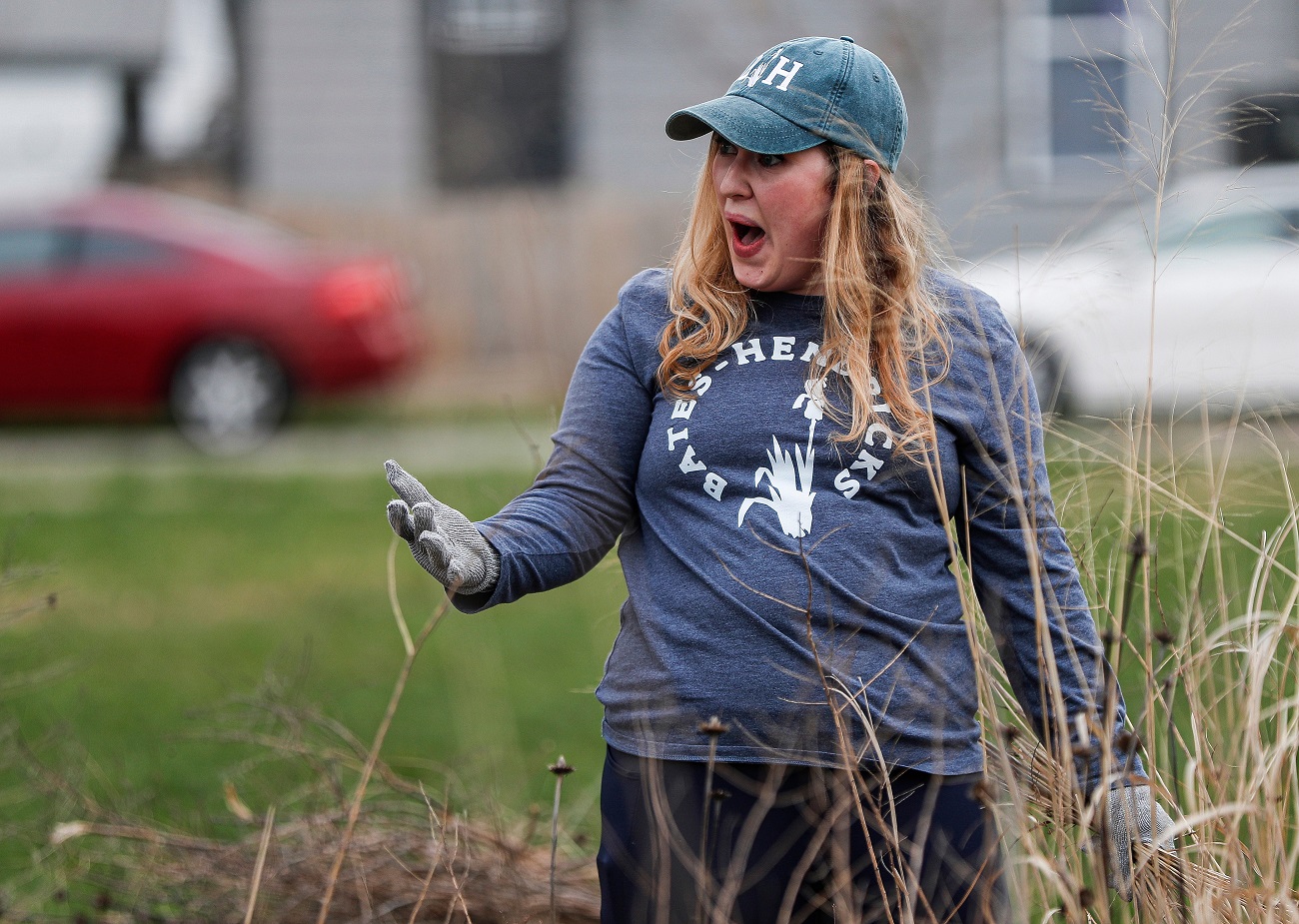 Member of the Bates-Hendricks neighborhood, Erin Chatten, talks with another neighbor while picking up trash and sticks at Baumann Park in Indianapolis, Wednesday, April 1, 2020.Ini Virtual Indy Cleanup