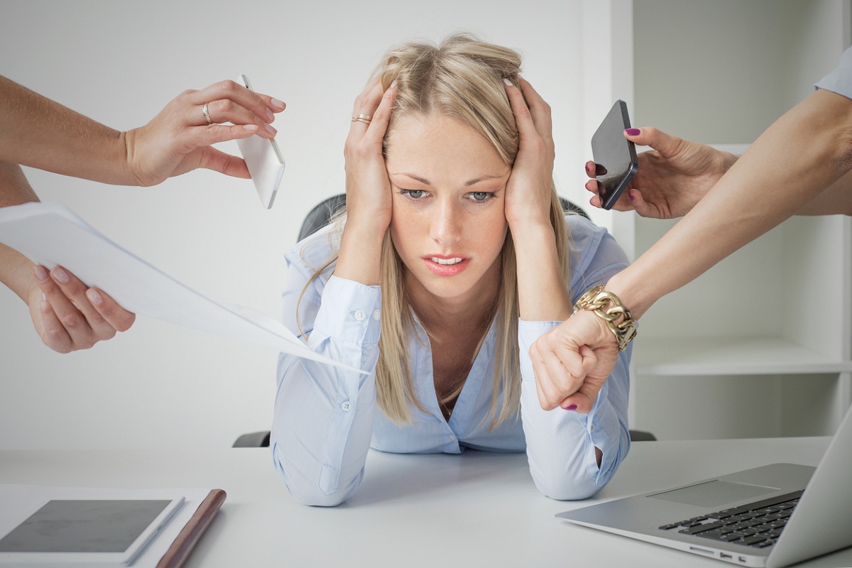 Pressure at work: depressed business woman