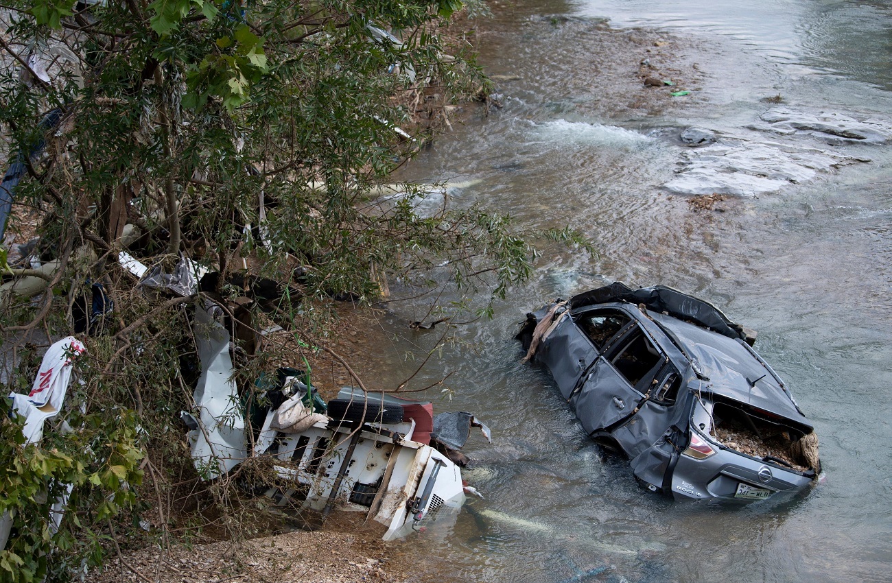 A flooded car and debris are seen after flooding in Trace Creek, Waverly, Tennessee, U.S., August 23, 2021. Picture taken August 23, 2021.  George Walker IV/The Tennessean/USA Today via REUTERS  THIS IMAGE HAS BEEN SUPPLIED BY A THIRD PARTY. MANDATORY CREDIT.