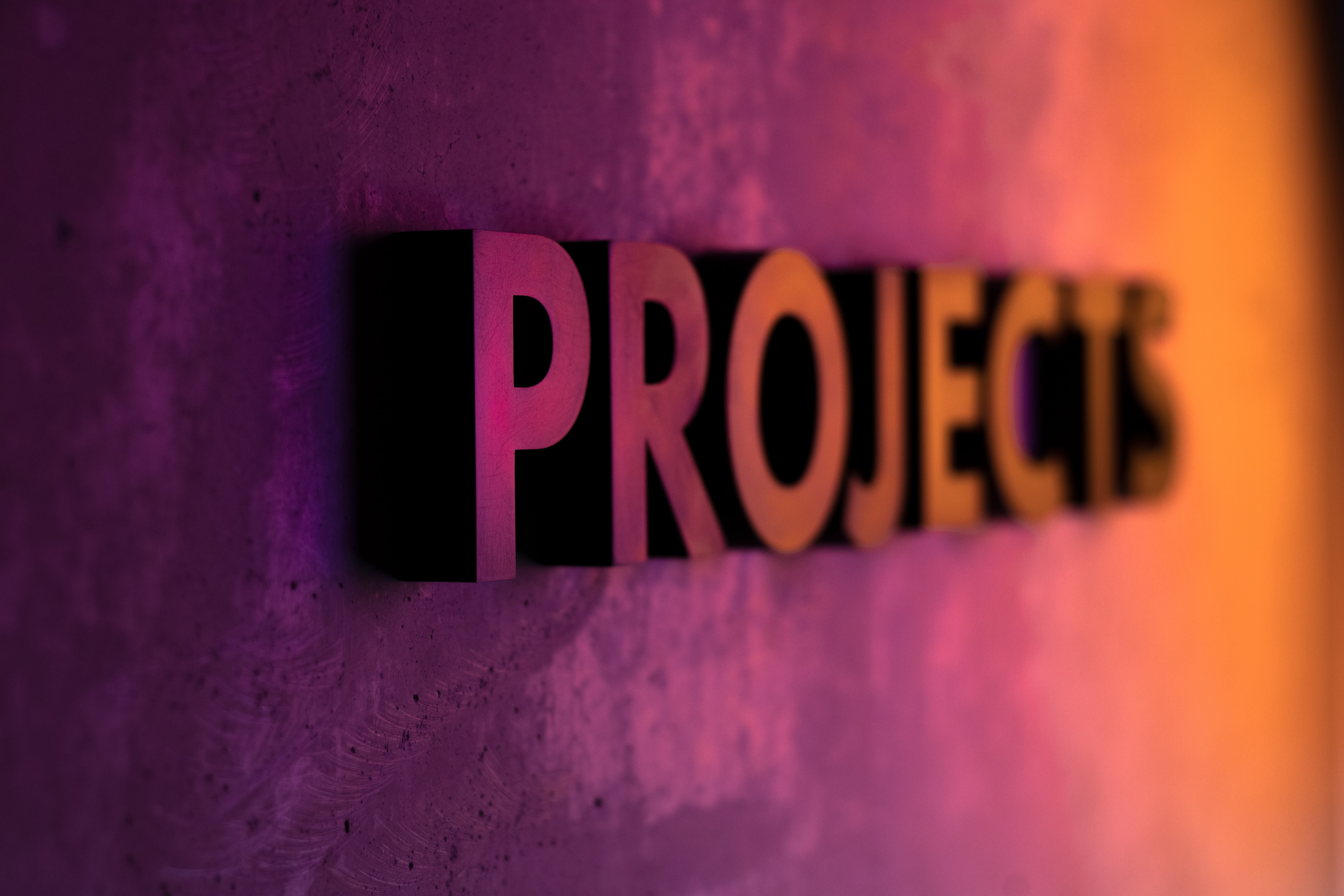 the word &quot;projects&quot; appears in 3D from a wall