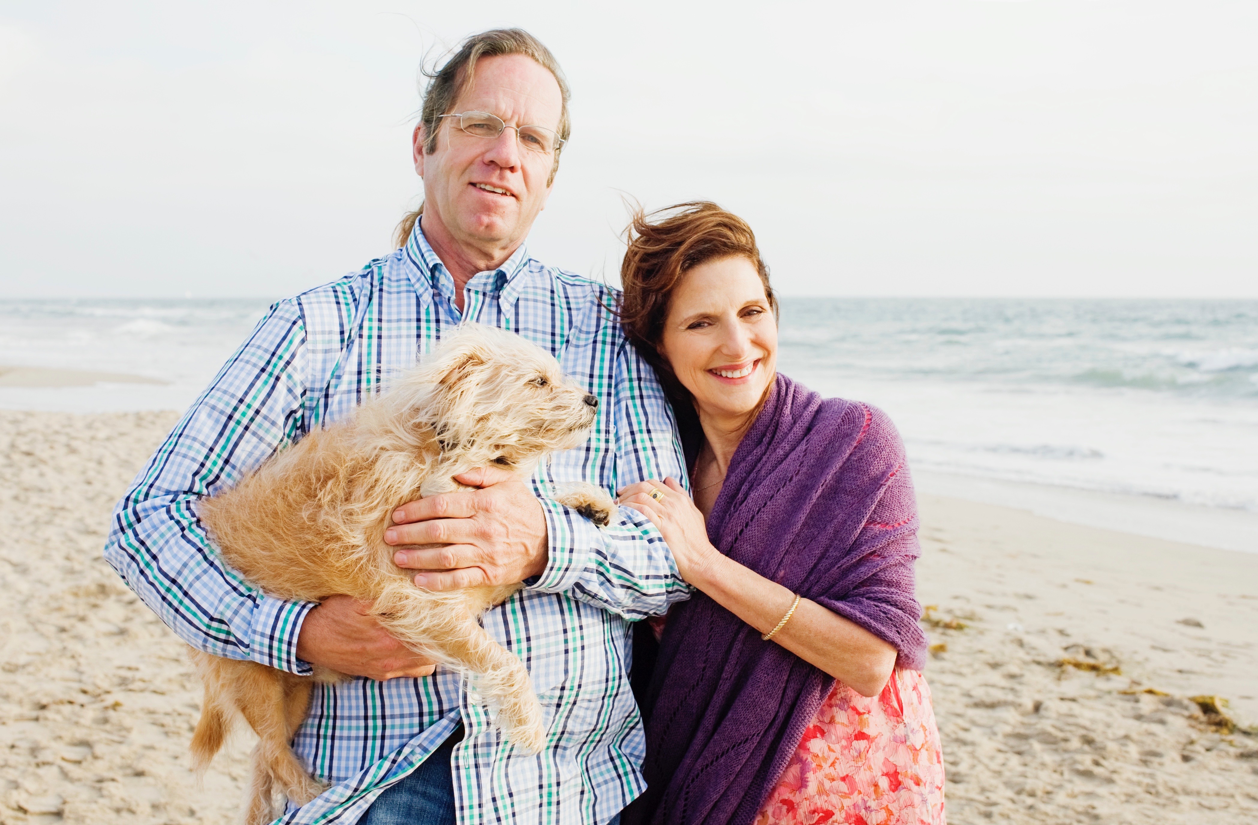 Elaine and Stephen with their dog Puck on the beach in Santa Monica.